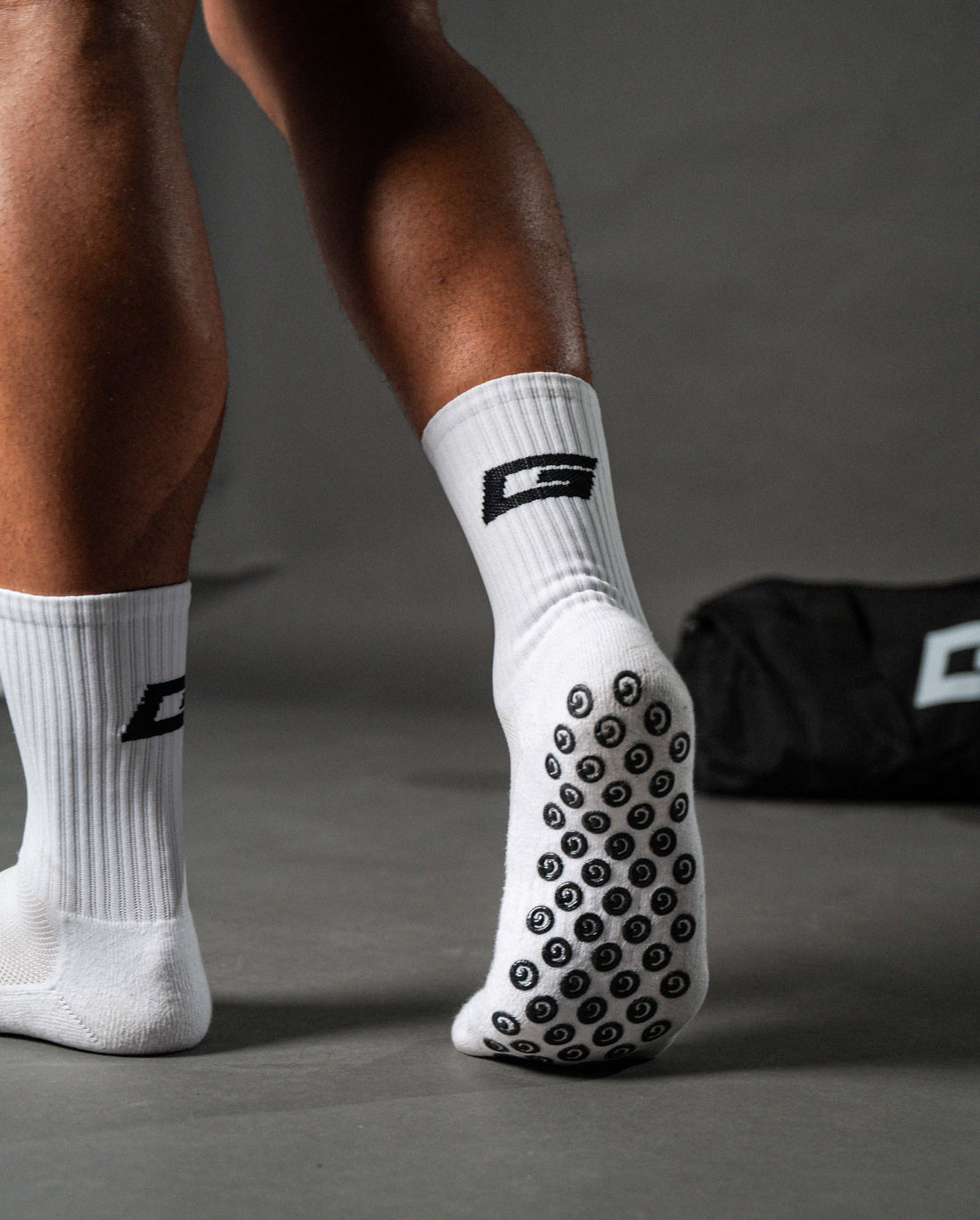 GearFit Halo grip socks in white, lifestyle photo