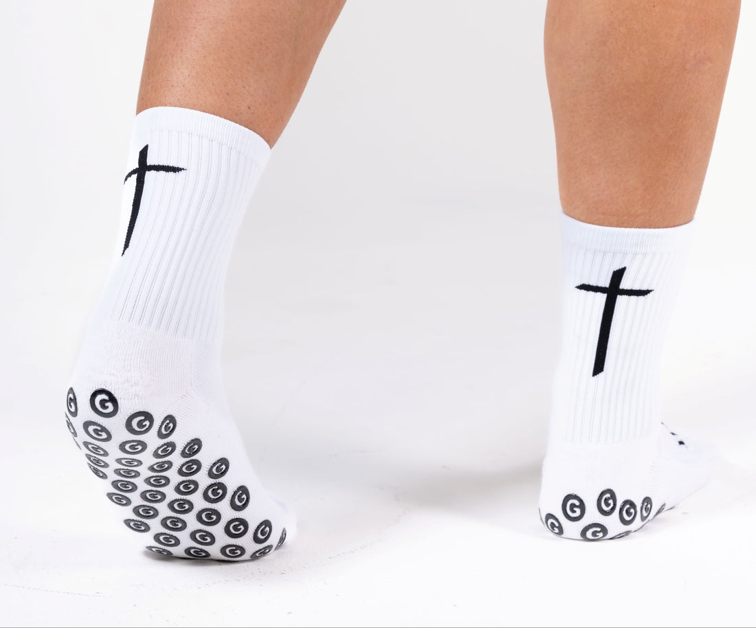 GearFit Invictus grip socks in white with black cross design