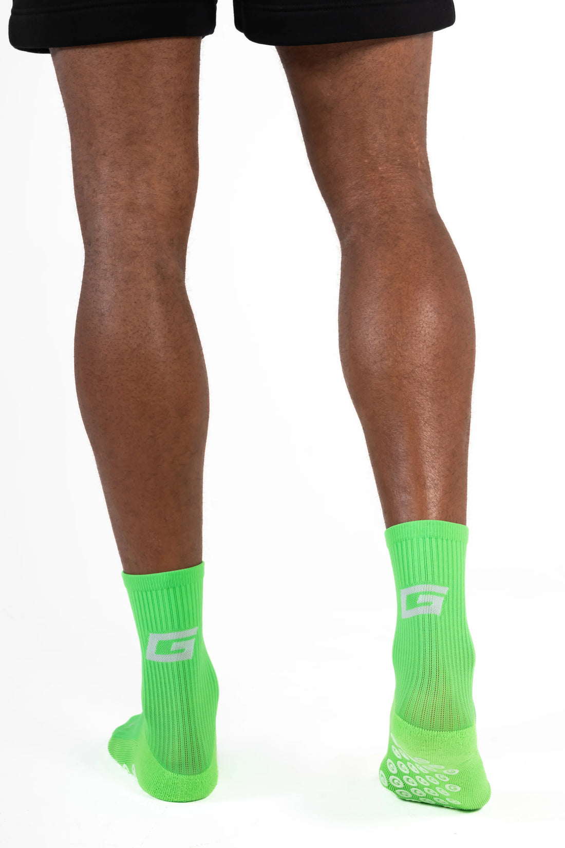 GearFit Lime grip socks in lime green, lifestyle photo