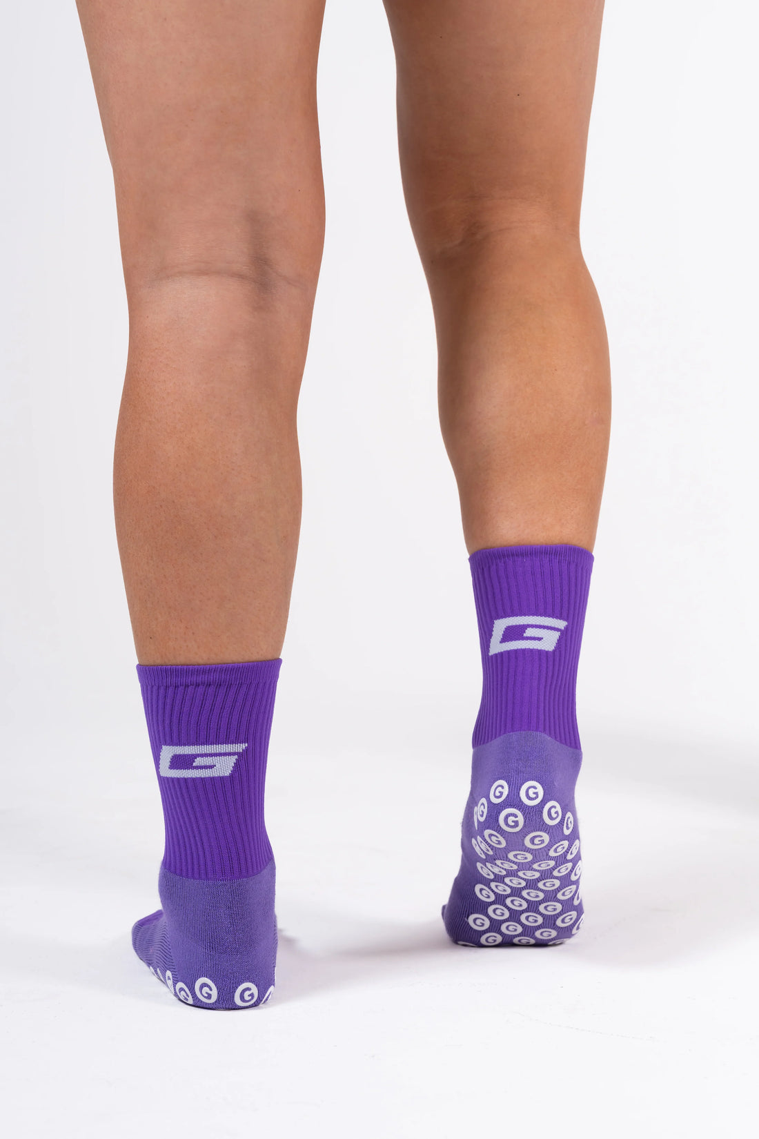GearFit Phantom grip socks in purple, lifestyle photo