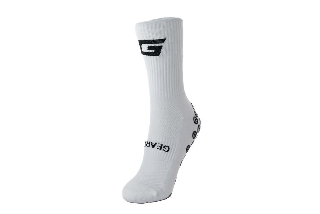 GearFit Invictus grip socks in white with black cross design, front view
