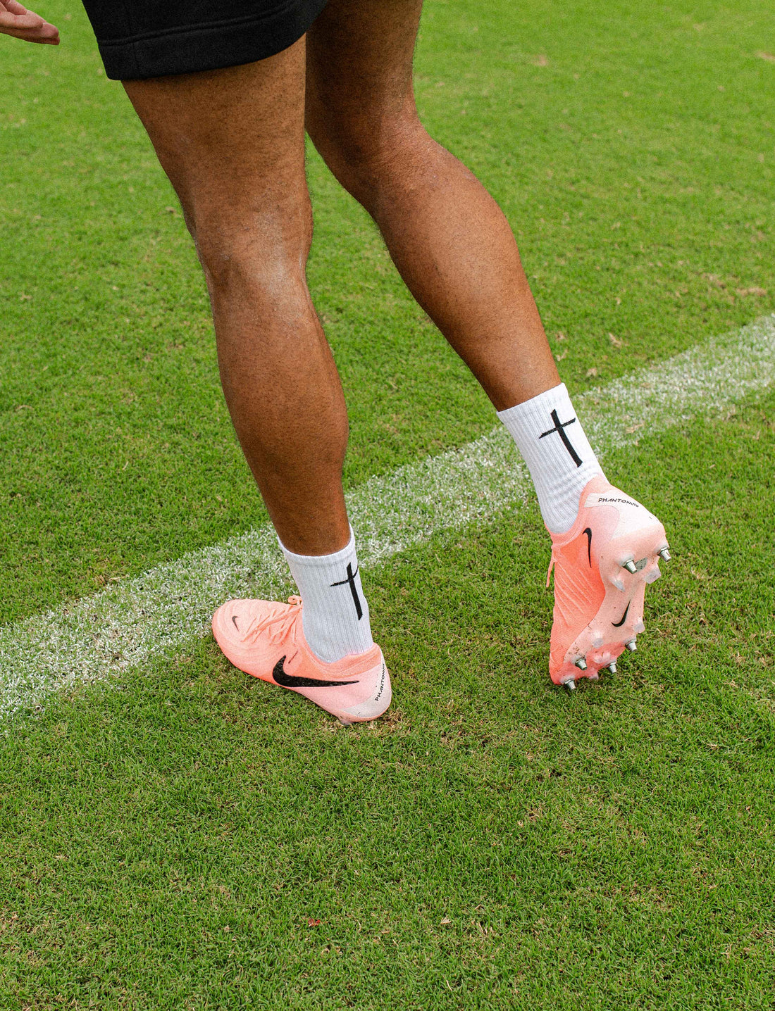 GearFit Invictus grip socks in white with black cross design