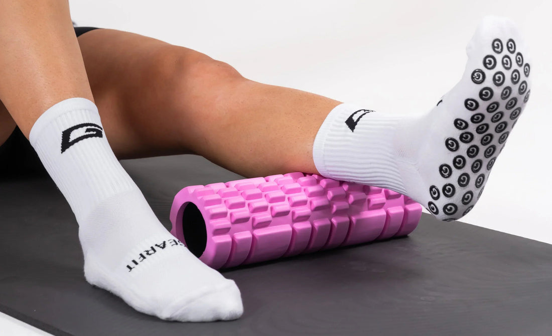 GearFit grip socks in white, foam roller recovery lifestyle photo