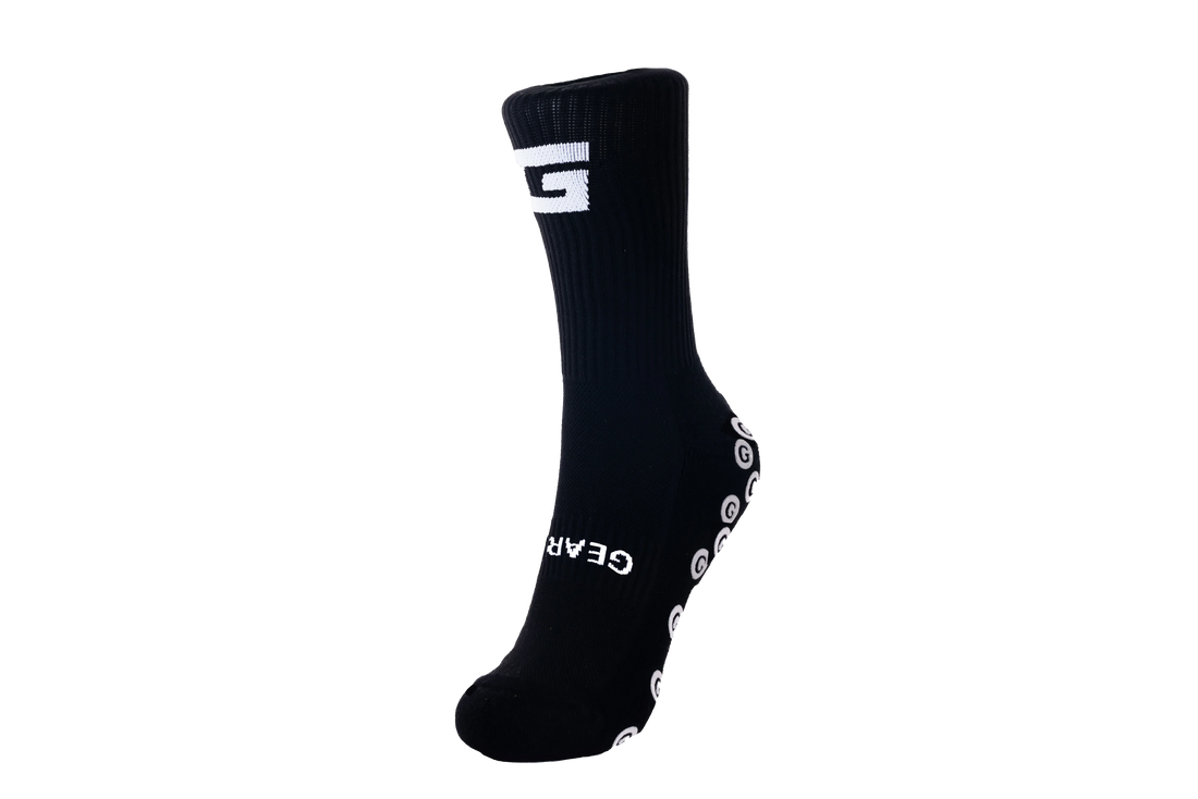 GearFit Legacy grip socks in black with cross design, front view